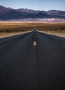 Scenic view of a long winding road against a backdrop of majestic mountains Royalty Free Stock Photo