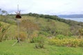 Scenic view of lush green trees growing on hilly terrain against cloudy sky with lake arenal in costa rica Royalty Free Stock Photo