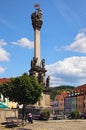 Scenic view of main square of medieval Loket city with ancient Plague Column by summer day.