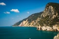 Scenic view of majestic cliffs surrounded by blue waters. Portofino, Italy