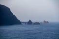 Scenic view of majestic sea stacks Ilheus da Janela Atlantic Ocean seen from idyllic volcanic black sand beach Praia Seixal