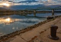 Scenic view of Maria Valeria bridge with reflection in Danube river, Esztergom, Hungary at sunrise