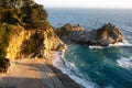 Scenic view of McWay Falls in Big Sur, California with rocks near the coast Royalty Free Stock Photo