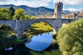 Scenic view of a medieval bridge over the Fluvia river in Besalu village, Girona, Catalonia, Spain Royalty Free Stock Photo