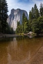 Scenic view of the merced river in the Yosemite valley, with the rocky mountains reflected on the water, in California Royalty Free Stock Photo