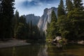 Scenic view of the merced river in the Yosemite valley, with the rocky mountains reflected on the water, in California Royalty Free Stock Photo