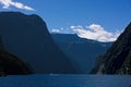Scenic view on the Milford Sound from a boat cruise in new zealand. Milford Sound, New Zealand in sunset hours.Mysterious day in M Royalty Free Stock Photo