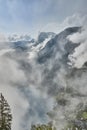 Scenic view of misty mountains above Halstatt village in Austria. Royalty Free Stock Photo
