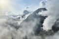 Scenic view of misty mountains above Halstatt village in Austria. Royalty Free Stock Photo