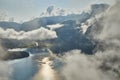 Scenic view of misty mountains above Halstatt village in Austria. Royalty Free Stock Photo