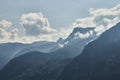 Scenic view of misty mountains above Halstatt village in Austria. Royalty Free Stock Photo