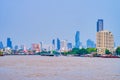 The scenic view on modern Bangkok from the boat on Chao Phraya River, Thailand