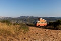 scenic view of motorhome and distant village in beautiful mountains