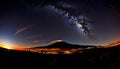 Scenic view of a mountainous landscape creating a shimmering reflection of the milky sky