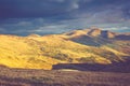 Scenic view of mountains, autumn landscape with colorful hills at sunset. Royalty Free Stock Photo