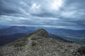 Scenic view of mountains and beautiful cloudscape from a rocky mountain summit