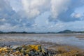 Scenic View Of Mud Beach Against Broken Ship Cloudy Sky. Royalty Free Stock Photo