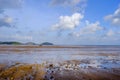 Scenic View Of Mud Beach Against Broken Ship Cloudy Sky. Royalty Free Stock Photo