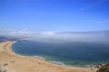 Scenic view of Nazare beach. Coastline of Atlantic ocean. Portuguese seaside town on Silver coast. The clouds above the water are