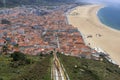 Scenic view of Nazare beach from the funicular. Coastline of Atlantic ocean. Portuguese seaside town on Silver coast. White houses Royalty Free Stock Photo