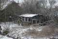 Decaying cabin in a wintry landscape Royalty Free Stock Photo