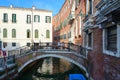 Scenic view of old buildings along narrow canal with bridge, Venice, Italy Royalty Free Stock Photo