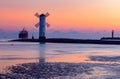 Swinoujscie. Famous old windmill lighthouse at sunrise. Royalty Free Stock Photo