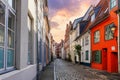 Scenic view old narrow european german Lubeck town street red brick ancient houses vintage iron stained glass lamp Royalty Free Stock Photo