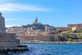 A scenic view of the old port (vieux port) entrance of Marseille, bouches-du-rhone, France with the Basilique Royalty Free Stock Photo