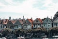 Scenic view of old residential houses on a green sidewalk on a sunny day