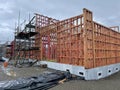Scenic view of the ongoing construction of a building with the use of wood and metal framing