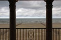 Scenic View Onto A Sandy Beach From A Terrace Framed With Columns Royalty Free Stock Photo