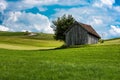 Scenic view over the German countryside around the village Kappel with two old wooden sheds over the green hills Royalty Free Stock Photo