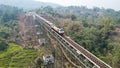 Scenic View of a Passenger Train Passing by Cikubang Bridge Longest Active Train Bridge in Indonesia. Bekasi, Indonesia November Royalty Free Stock Photo