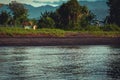 Scenic View Peaceful Sea Water Ripples and coastal land Tropical Beach Village At Dusk