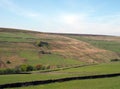 scenic view of pennine countryside above the lumb valley in calderdale near pecket well with dry stone walls surrounding meadows Royalty Free Stock Photo