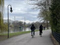 Scenic view of people cycling and walking in the park near the lake in Berlin, Germany