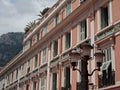 Scenic view of a pink old building with white windows in Monte Carlo, Monaco Royalty Free Stock Photo