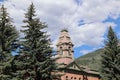 Scenic view of Pitkin country courthouse through pine trees in the Colorado Rocky Mountains