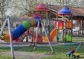 - Scenic view of a playground with a colorful slide and a swing-