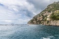 Scenic view of Positano cliff and sea with boats along Amalfi Coast in Campania, Italy Royalty Free Stock Photo