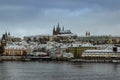 Scenic view of Prague Castle Saint Vitus cathedral covered with snow and Vltava River.Wanderlust travel background copy space. Royalty Free Stock Photo