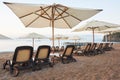 Scenic view of private sandy beach with sun beds from the sea and the mountains. Amara Dols Vita Luxury Hotel. Resort Royalty Free Stock Photo