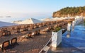 Scenic view of private sandy beach with sun beds from the sea and the mountains. Amara Dols Vita Luxury Hotel. Resort Royalty Free Stock Photo