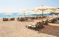 Scenic view of private sandy beach with sun beds from the sea and the mountains. Amara Dols Vita Luxury Hotel. Resort Royalty Free Stock Photo