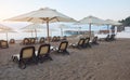 Scenic view of private sandy beach with sun beds from the sea and the mountains. Amara Dols Vita Luxury Hotel. Resort Royalty Free Stock Photo