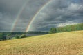 scenic view of rainbow over field against sky Royalty Free Stock Photo