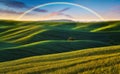 Scenic view of rainbow over green field Royalty Free Stock Photo