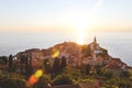 Scenic view of red roofs of the historical center of old town Piran with main church against the sunset . Royalty Free Stock Photo