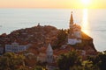 Scenic view of red roofs of the historical center of old town Piran with main church against the sunset . Royalty Free Stock Photo